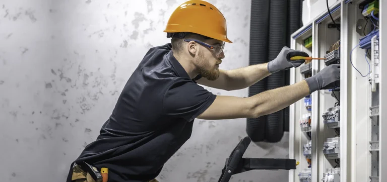 electrician-working-in-switchboard-with-electrical-2025-03-15-13-04-44-utc copy1